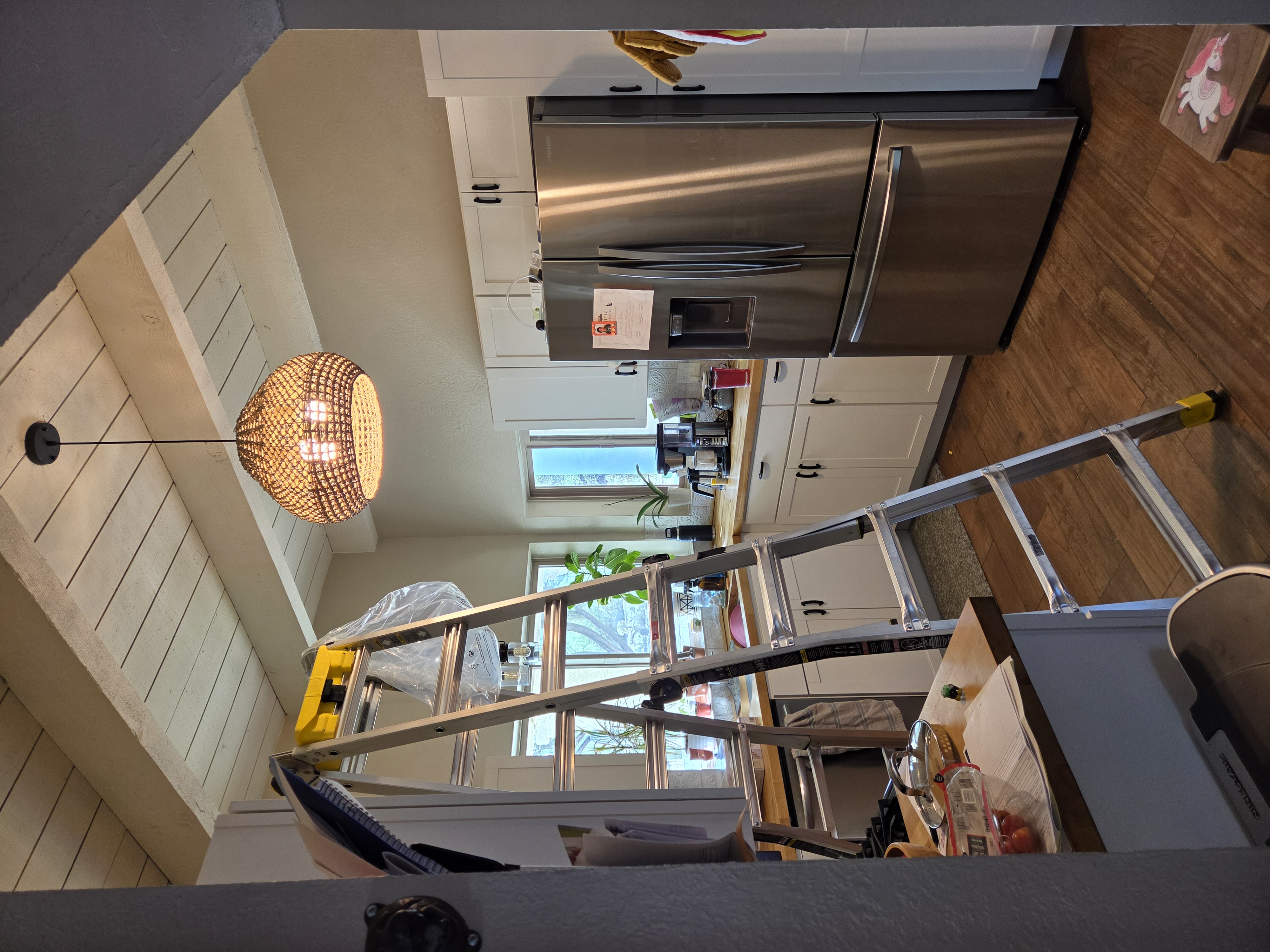 Woven pendant light installed in kitchen