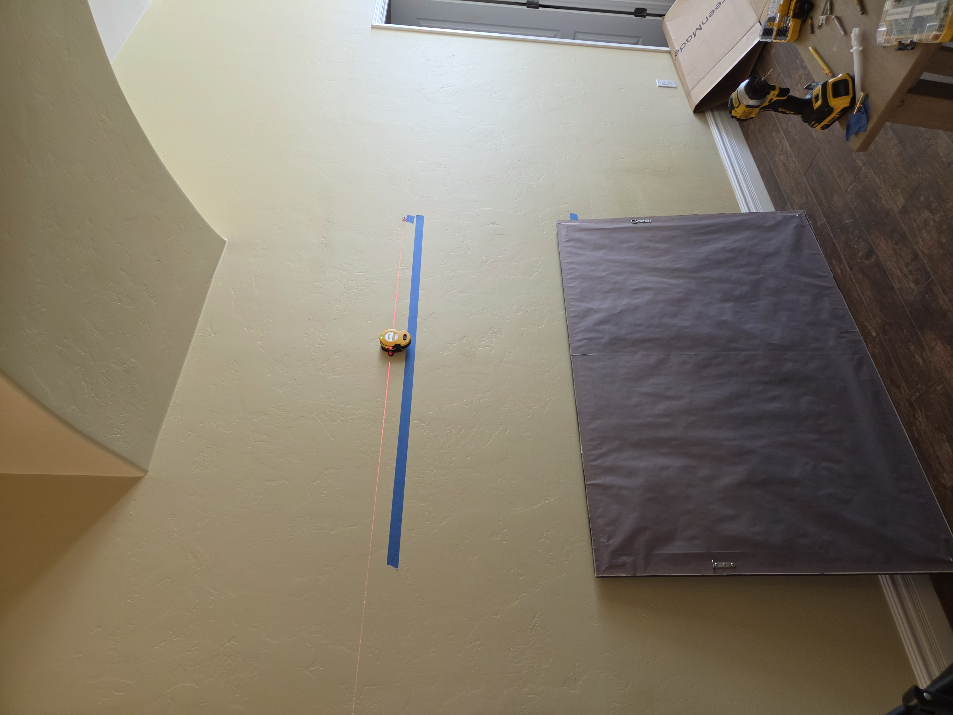 Laser line and tape marks for centered wall art install