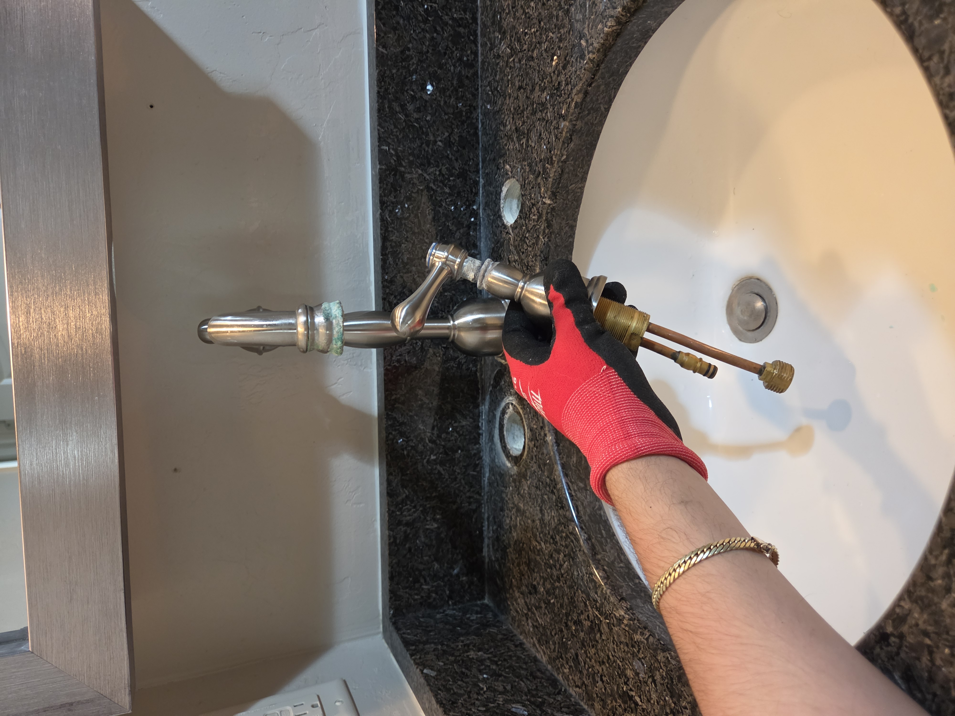 Old faucet removed during bathroom upgrade