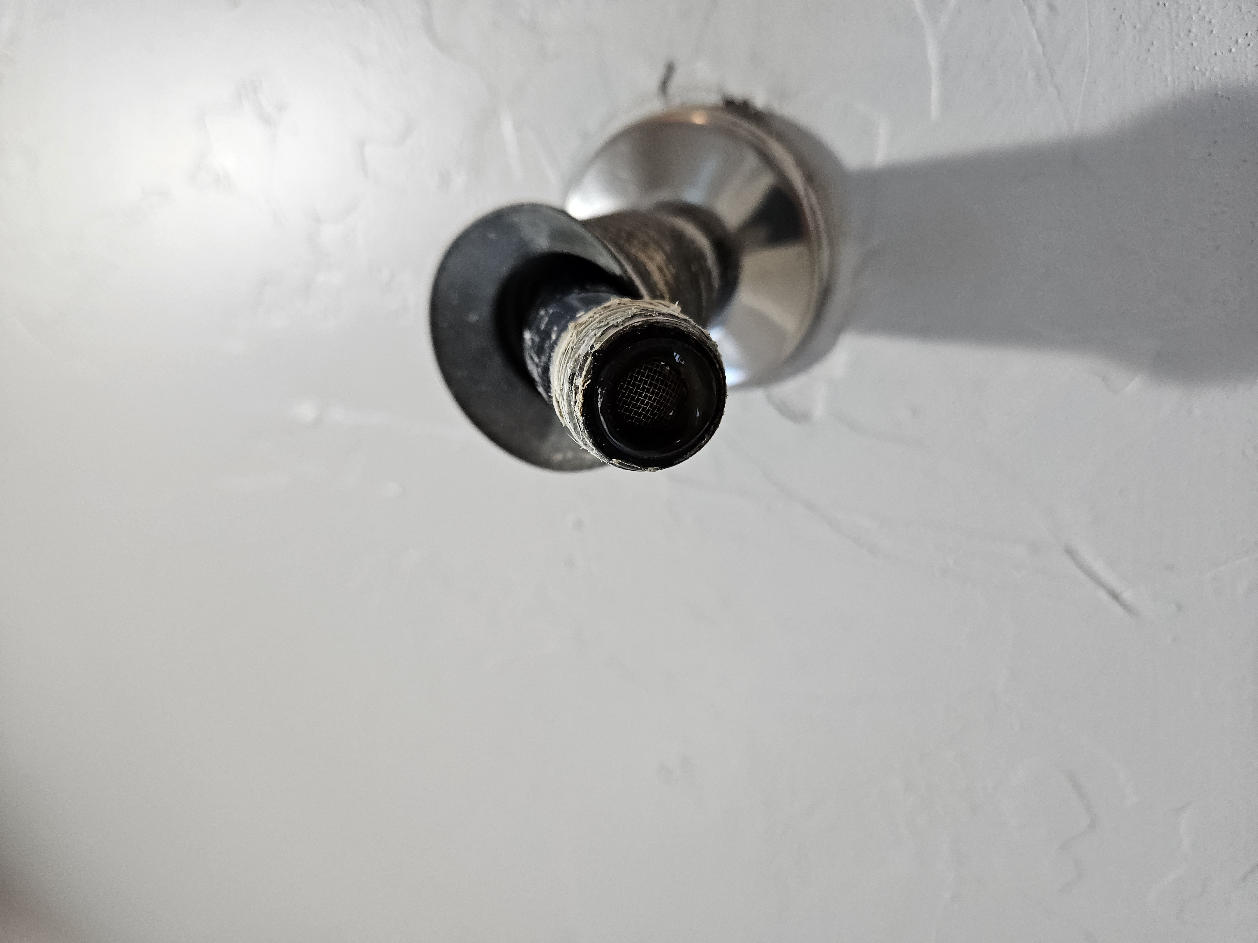 Shower arm thread prep closeup