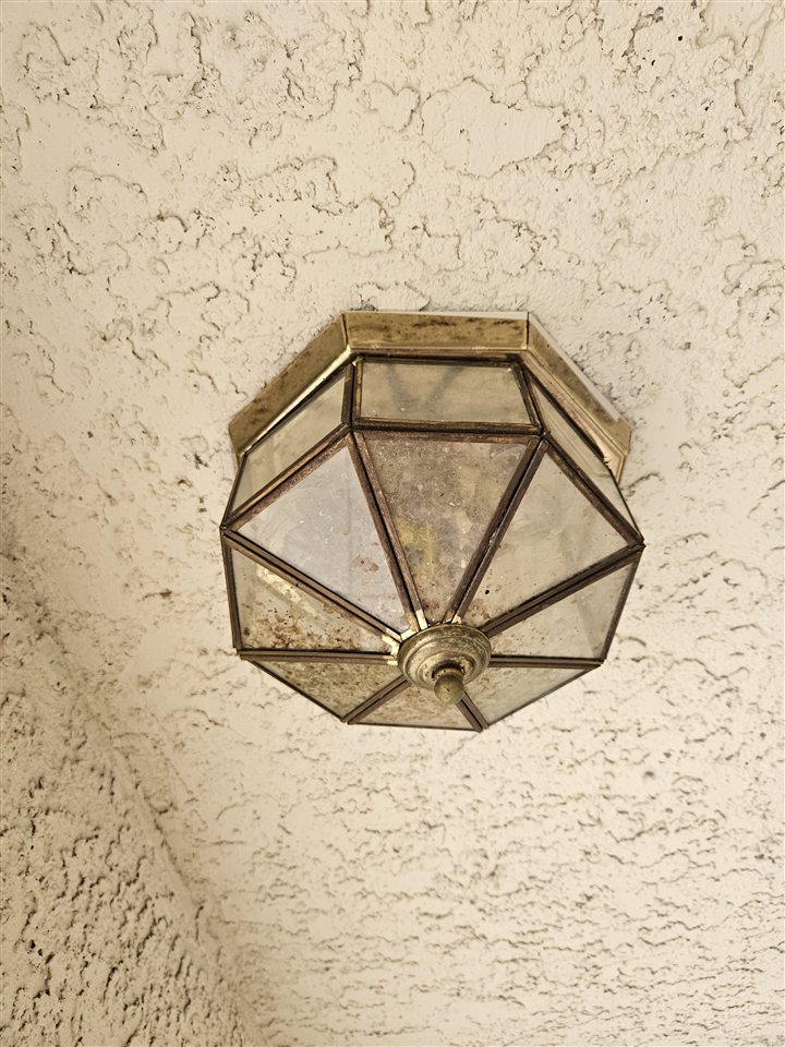 Old patio light fixture before upgrade