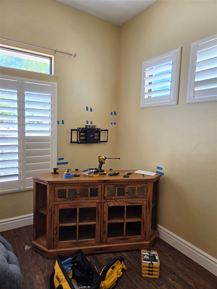 Television bracket and taxidermy layout during installation