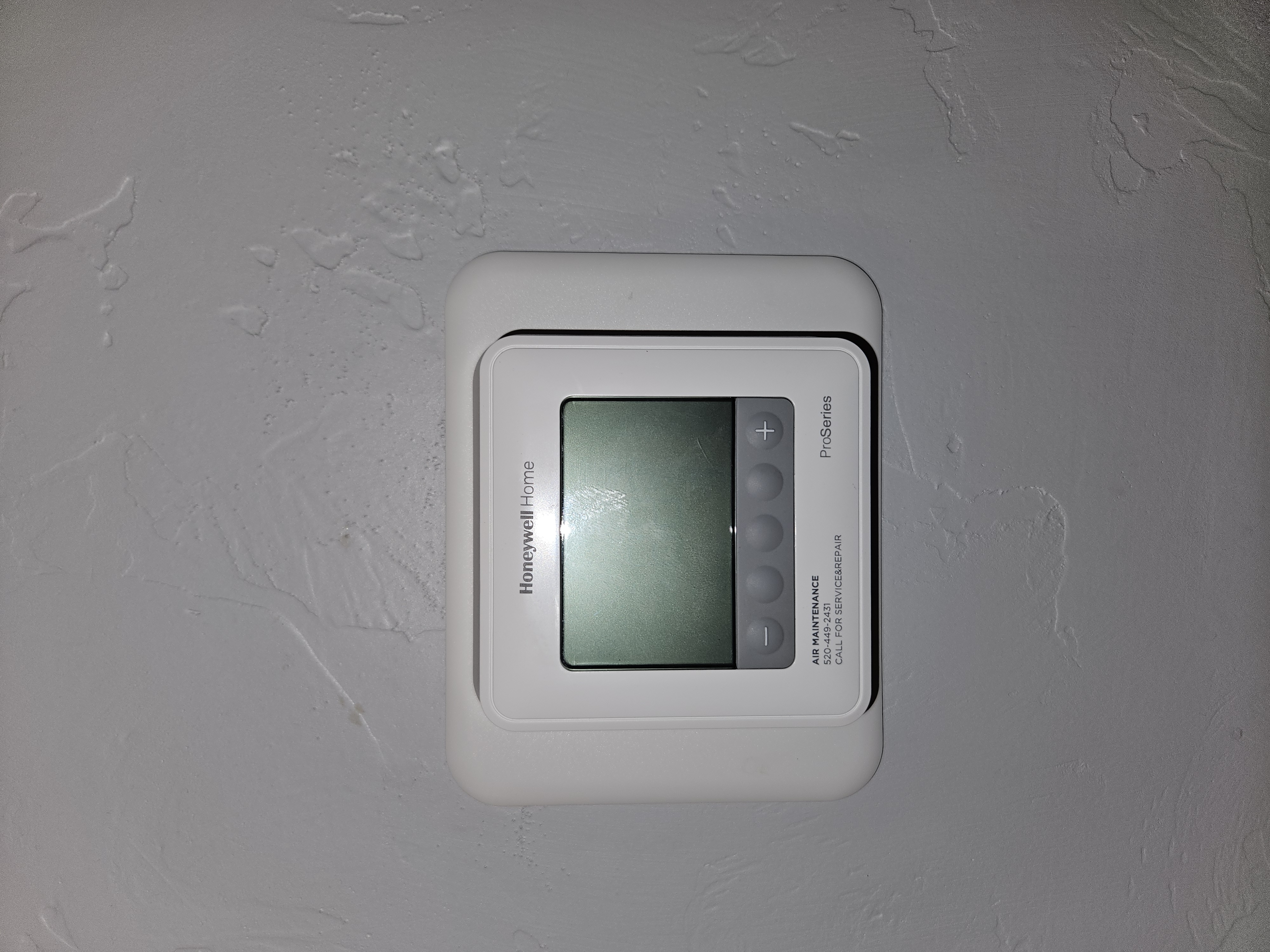 Older Honeywell thermostat before upgrade